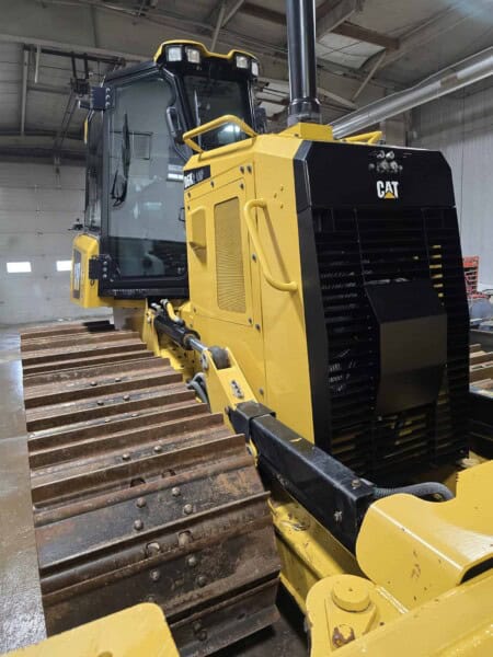 High-resolution image of a 2020 Caterpillar D6K2 bulldozer with a yellow and black exterior, showcasing its tracked undercarr.