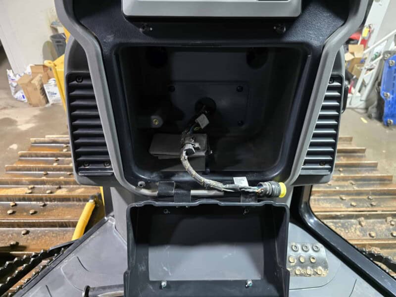 Close-up of hydraulic connections inside the engine compartment of a 2020 Cat D6K2.