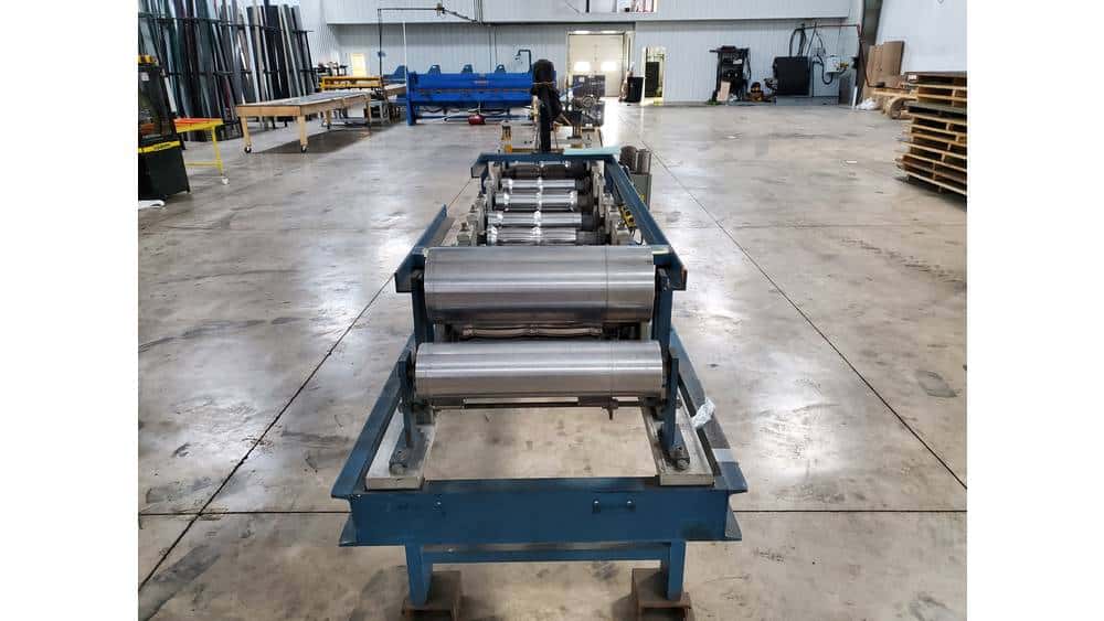 Heavy-duty industrial roller conveyor system in a spacious warehouse setting.