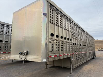 Heavy-duty 2017 EBY 50-foot livestock trailer with ventilation panels and sturdy construction.