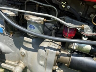 Close-up of engine components on a 1963 Massey Ferguson 50 tractor.