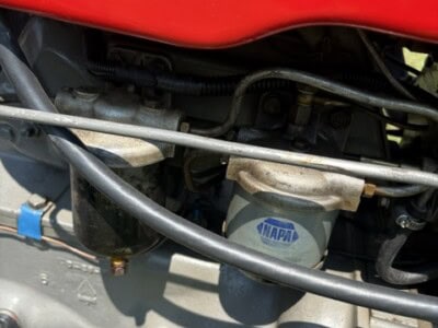 Close-up of Massey Ferguson 50 tractor engine with Multi-Power system and Napa filter.