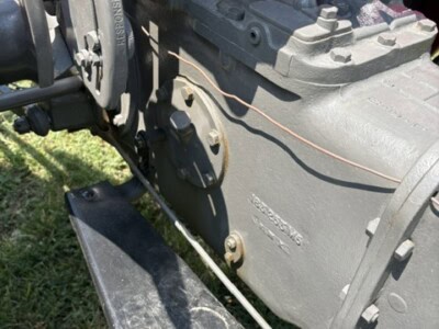 Close-up of Massey Ferguson 50 tractor transmission with visible gears and controls.