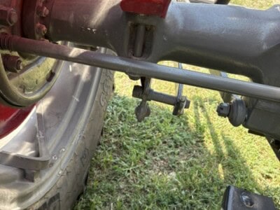 Close-up of tractor rear axle and hitch on a 1963 Massey Ferguson 50.