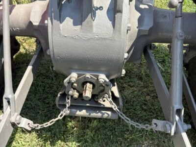 Close-up of Massey Ferguson 50 tractor gearbox with visible chains and mechanical parts.