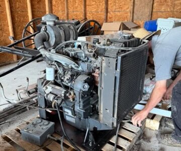 Iveco diesel power unit with radiator and engine components on a wooden pallet.