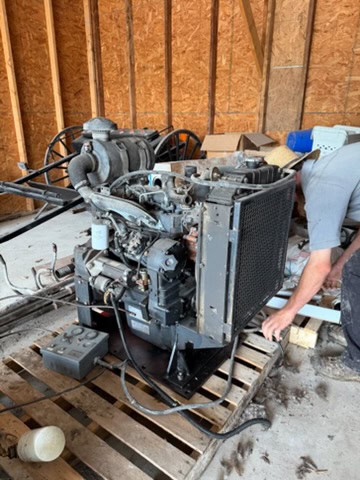 Iveco diesel power unit with radiator and engine components on a wooden pallet.