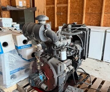Iveco diesel engine with control panel in workshop setting.