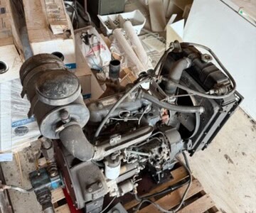 Iveco diesel power unit with visible engine components and control panel on a wooden pallet.