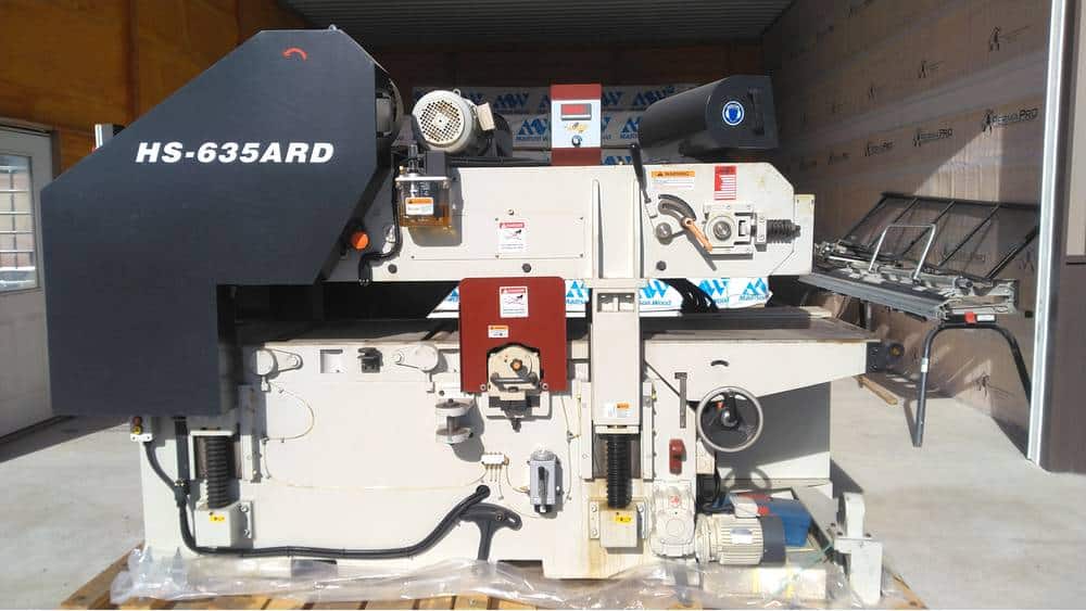 Heavy industrial paper cutting machine HS-635ARD with digital controls and safety features.