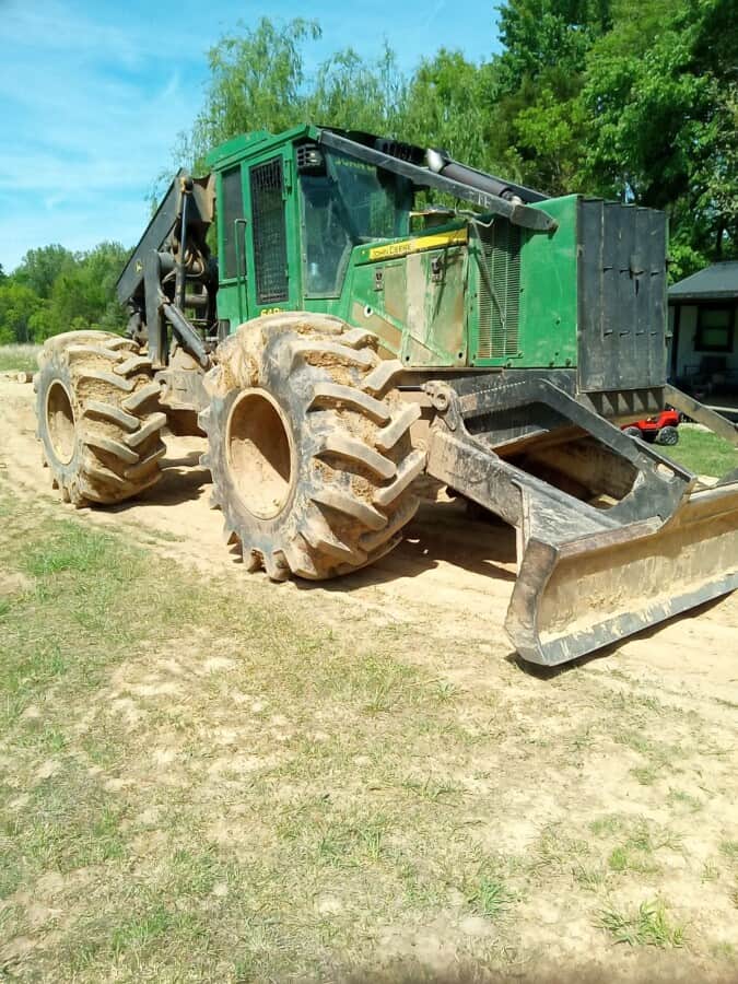 Green John Deere 644K Wheel Loader with large tires and front bucket attachment.