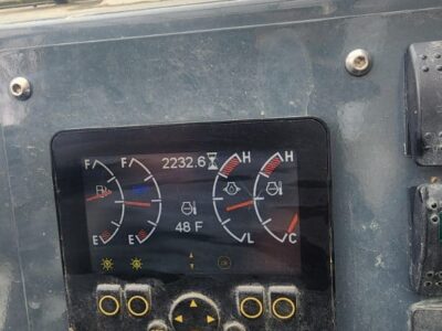 Control panel of a 2017 Gehl RS8-44 skid steer loader with temperature and fuel gauges.