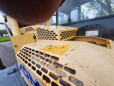 Heavy-duty yellow Gehl RS8-44 skid steer loader with ventilation grilles and worn surface details.