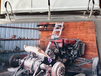 Vintage 1963 Massey Ferguson 50 tractor engine on display for restoration.