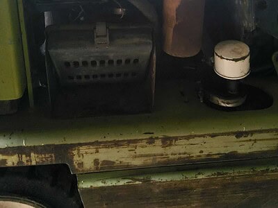 Close-up of engine and hydraulic parts inside a Clark 3000 LB forklift.
