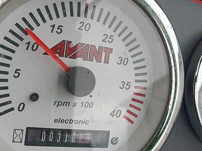 Close-up of Avant electronic tachometer showing 10 RPM x 100 with a reading of 310.