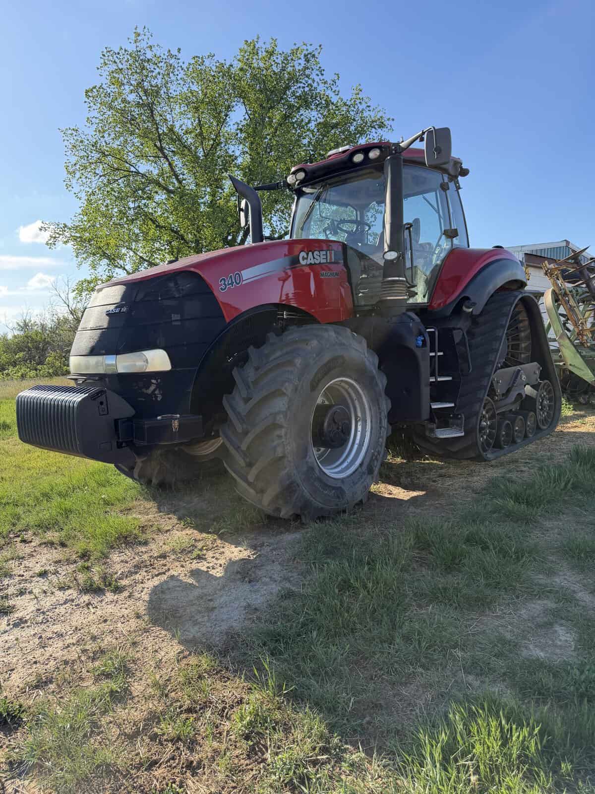 2016 Case IH Magnum 340 Tractor for Sale 2016 Case IH Magnum 340 tractor with cab and large tires on grassy field.
