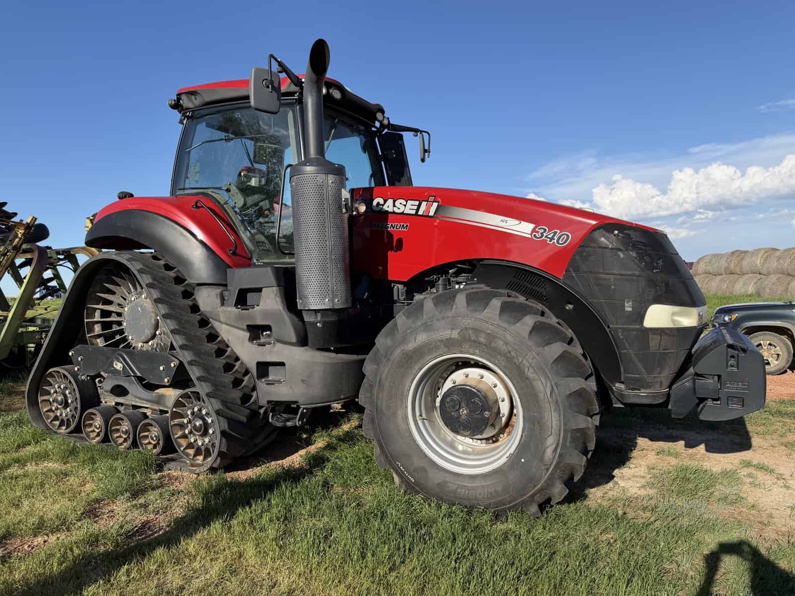 2016 Case IH Magnum 340 Tractor for Sale 2016 Case IH Magnum 340 tractor with cab and track system on grassy field.