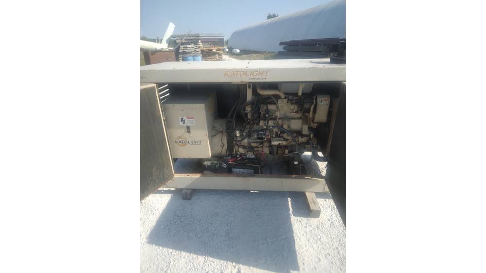 Industrial generator engine with visible components, no specific make or model identified.