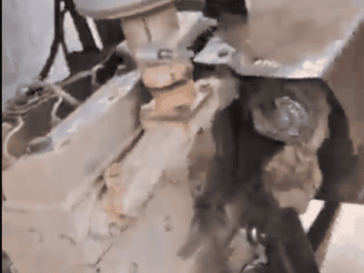Close-up of a Cummins B3.3 diesel engine with visible components and mounting details.