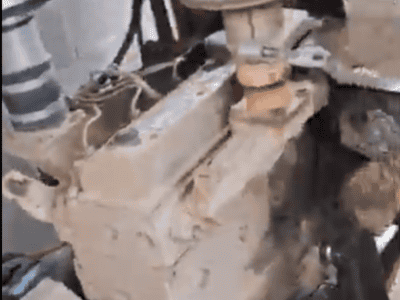 Close-up of a Cummins B3.3 diesel engine with visible fuel filter and engine block.