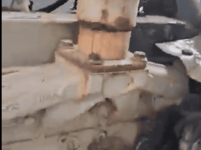 Close-up of a Cummins B3.3 diesel engine with visible hoses and metal components.