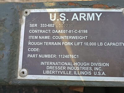 U.S. Army rough terrain fork lift with 10,000 lb capacity, model not specified, used for heavy-duty material handling.