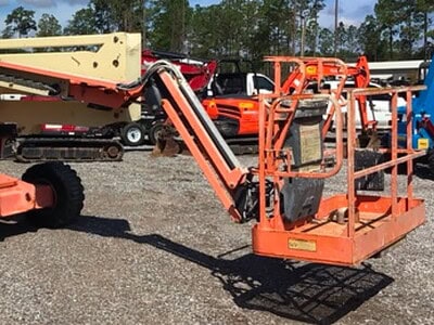 Telescopic boom lift, orange, used for aerial work, no visible year or model.