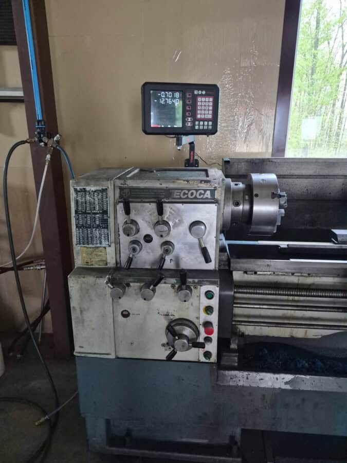 Ecoca metal lathe machine with digital control panel, used for precision machining.