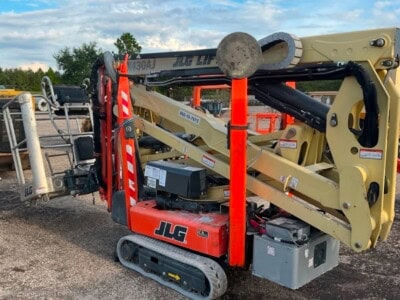 JLG 1930ES electric boom lift, compact aerial work platform, used for construction and maintenance tasks.
