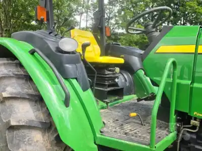 2007 John Deere 5425 tractor with cab and front loader attachment in green and yellow.