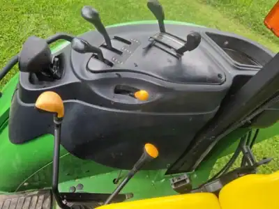 Close-up of tractor controls and dashboard on a green John Deere 5425.