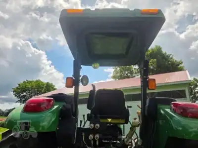 2007 John Deere 5425 compact utility tractor with cab and front loader attachment.