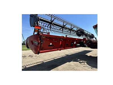 Harvester header for combine harvester, red color, with metal tines and cutting mechanism.