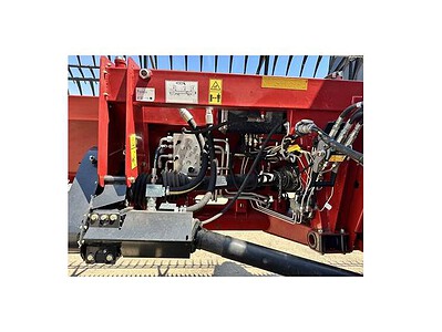 John Deere 2020 rotary cutter showing hydraulic lift system and cutting blades.