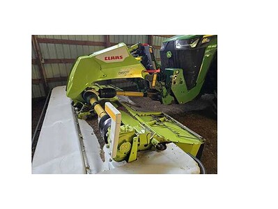 Claas Disco 3050 RCX mower conditioner attached to a tractor, used for hay and forage harvesting.