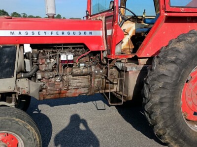 Massey Ferguson 1130 tractor with visible engine and large rear tires.