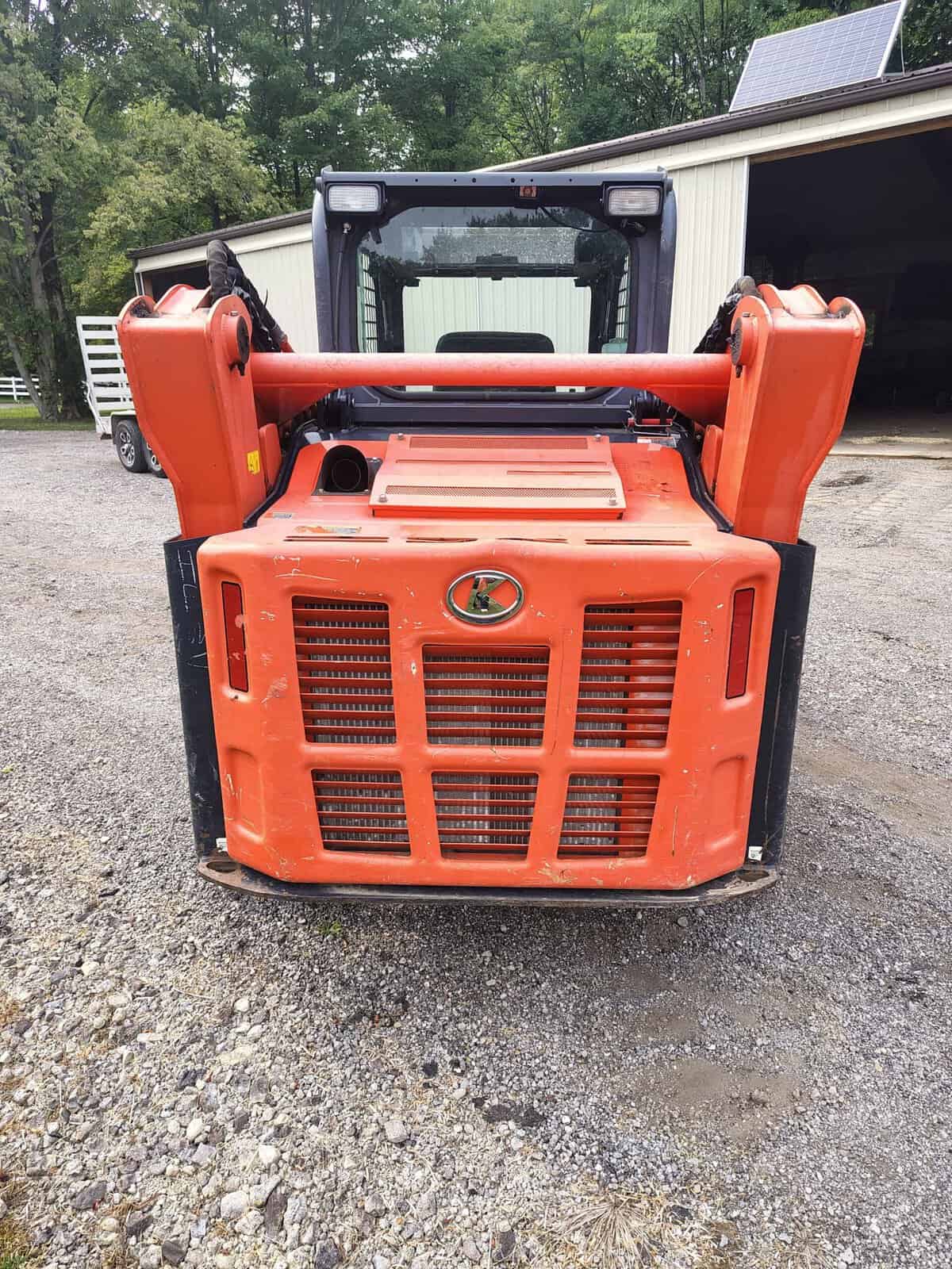 1000003759 (1) 2020 Kubota SVL75-2 compact track loader with orange body and enclosed cab.