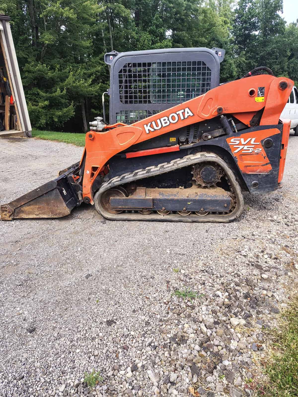 1000003760 (1) 2020 Kubota SVL75-2 compact track loader with orange body and black tracks, outdoor setting.