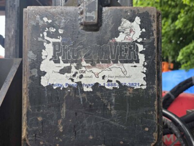 Worn Pitts Power Equipment sign on industrial machinery with peeling paint and rust.