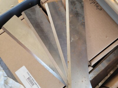 Set of metal blades for circular sawmill and planer machinery, various sizes and conditions.