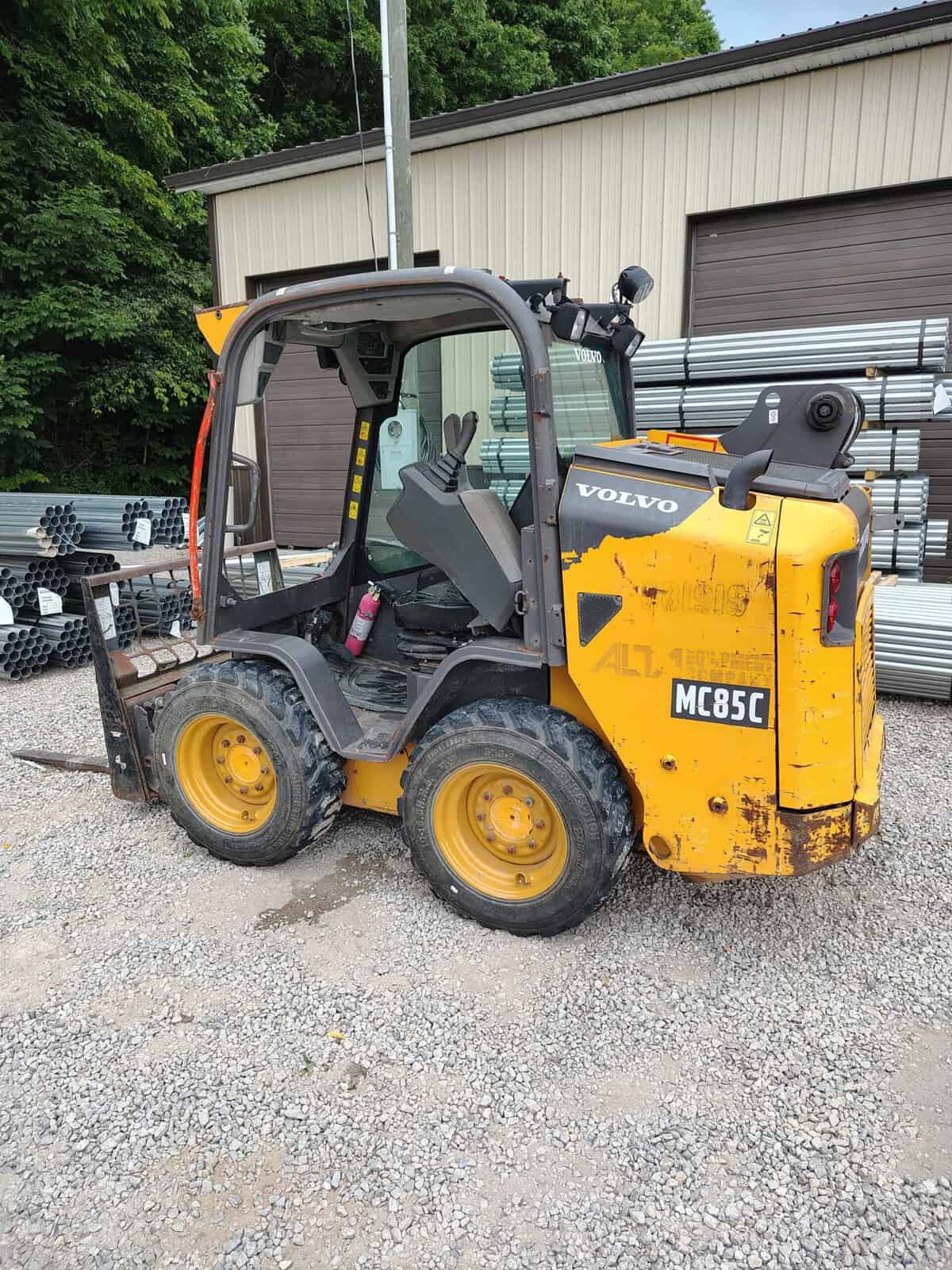 1546 (1) 2019 Volvo MC85C compact wheel loader with enclosed cab and yellow and black body.