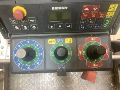 Control panel of a 2022 DINO 92RXTE boom lift with joysticks and control buttons.