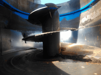 Close-up of PATZ 420 stationary TMR mixer auger with visible wear and mixing chamber details.