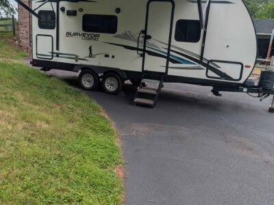 2021 Forest River Surveyor 203RLKE travel trailer with slide-out and awning.