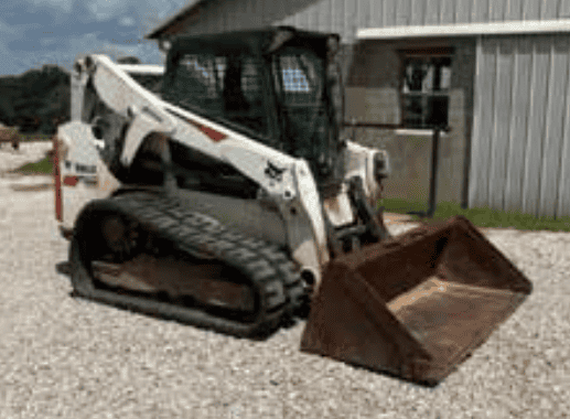 2018 Bobcat T650 compact track loader with bucket attachment on gravel surface.