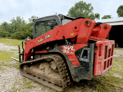 2016 Kubota SVL95-2 compact track loader with enclosed cab and rubber tracks.