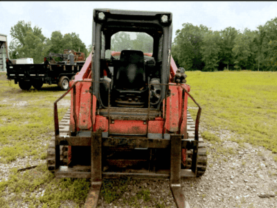 2016 Kubota SVL95-2 compact track loader with visible tracks and cab.