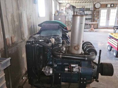 KUBOTA V3600 diesel power unit with visible engine components and exhaust system.