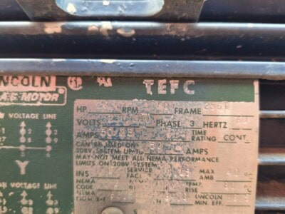 Lincoln TEFC electric motor with rust and wear, model unknown, used in industrial applications.